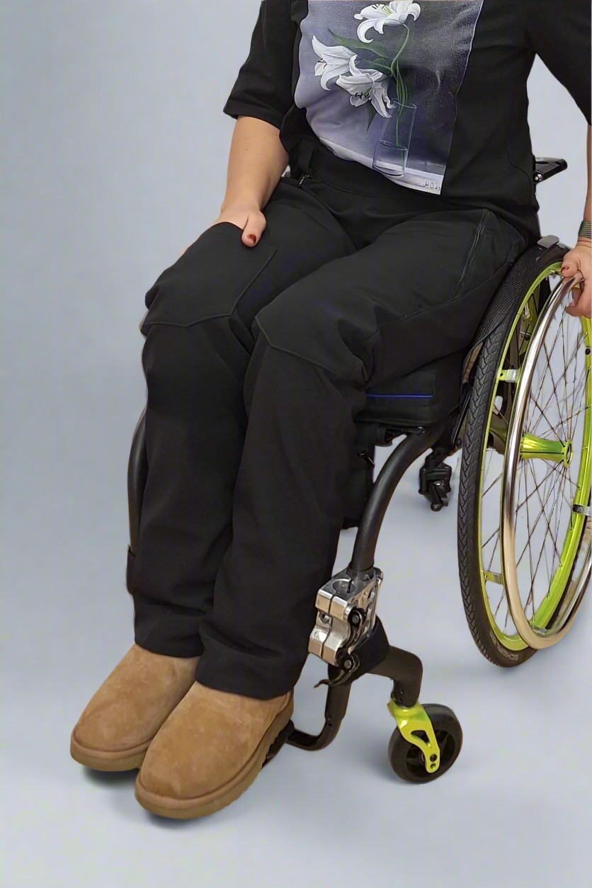 woman in a wheelchair wearing warm softshell adaptive pants from Vilber's
