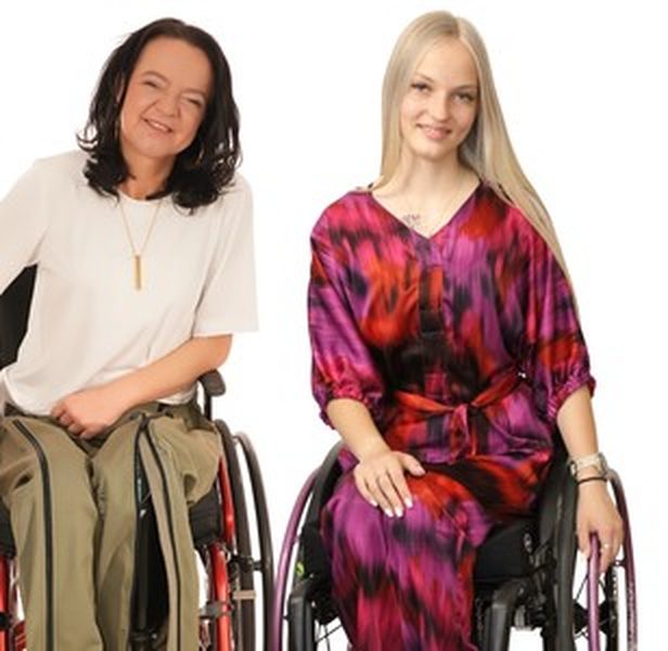 Two wheelchair users wearing Vilber's clothing