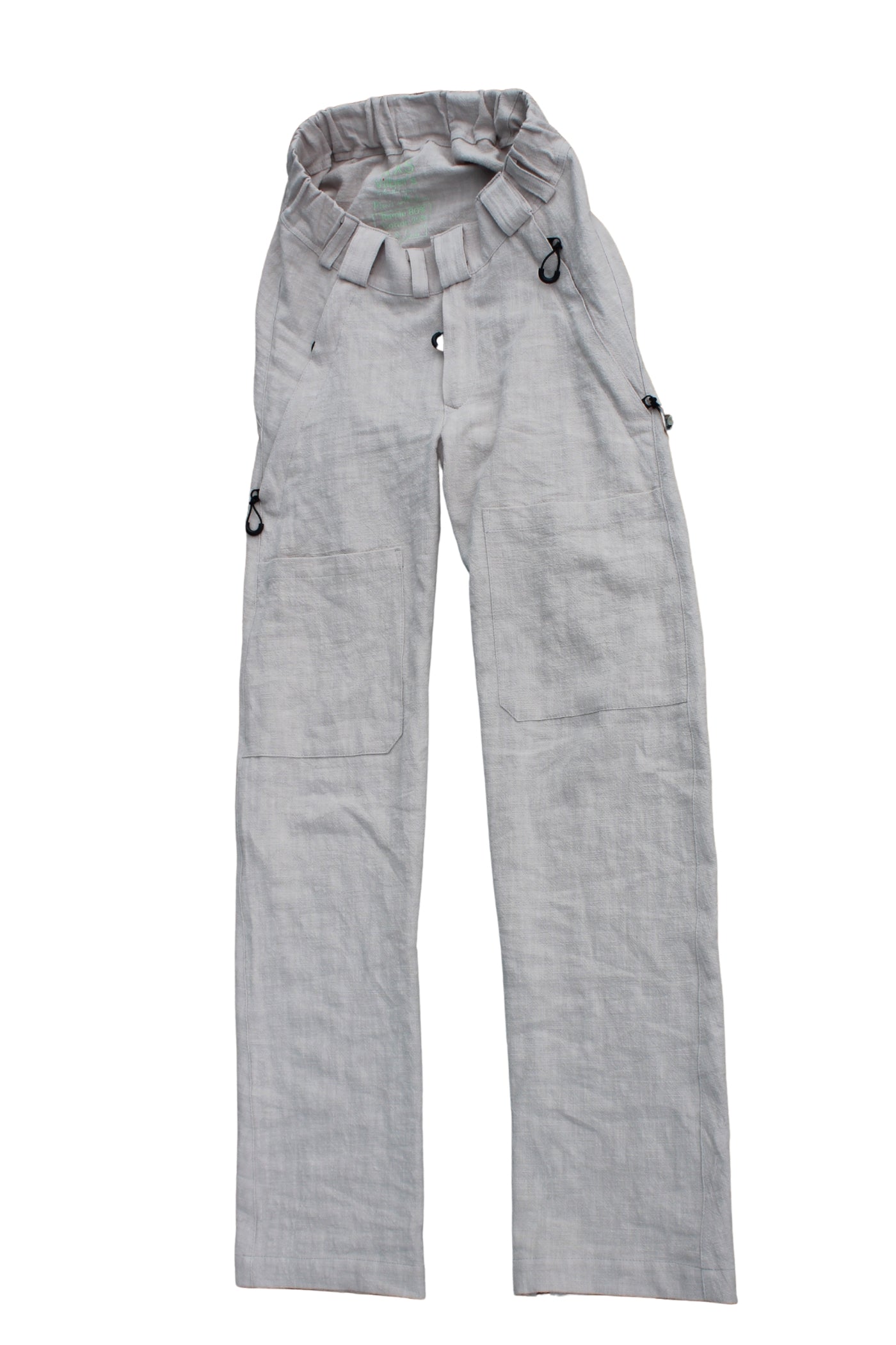 Vilber's men's summer trousers in beige ramie fabric, laid flat showing elasticated waistband and front opening.