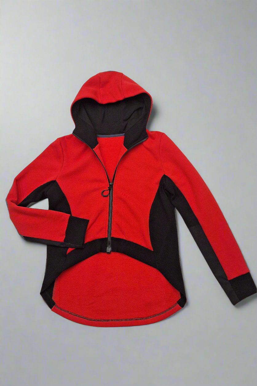 Red adaptive hoodie lying flat on white surface