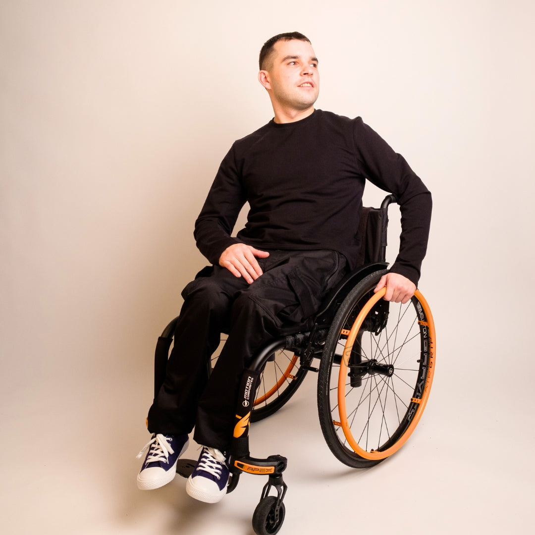 A man wearing wheelchair adapted clothing