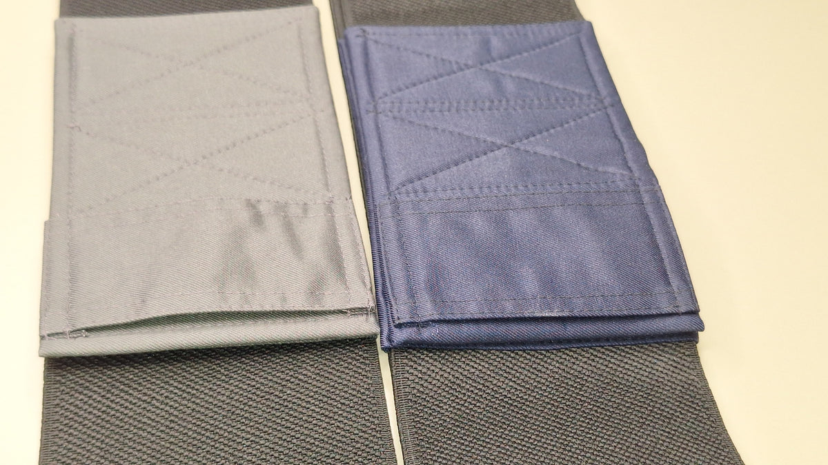Wide elastic strap for keeping legs together for wheelchair users